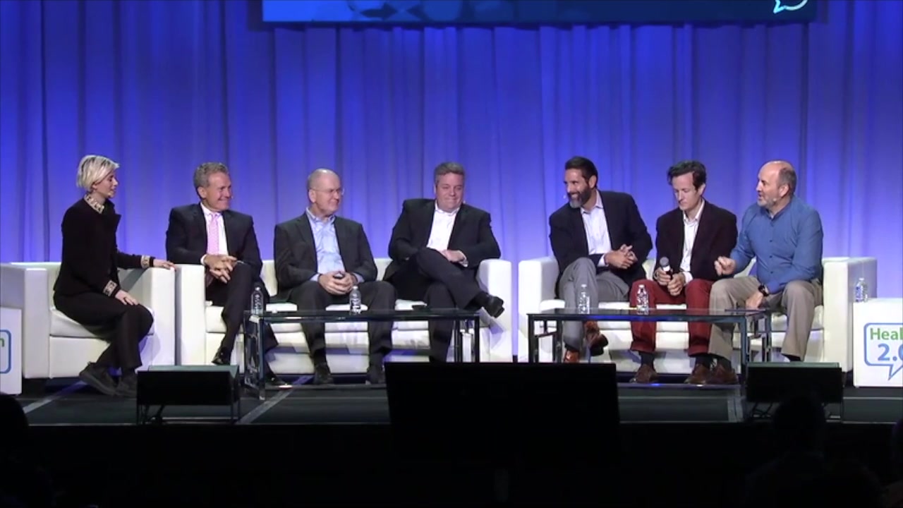 Health 2.0 conference panel — seven panelists on stage, Lonnie on the far left.
